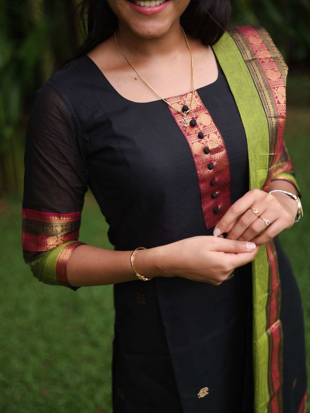 Black with Olive green rich pallu