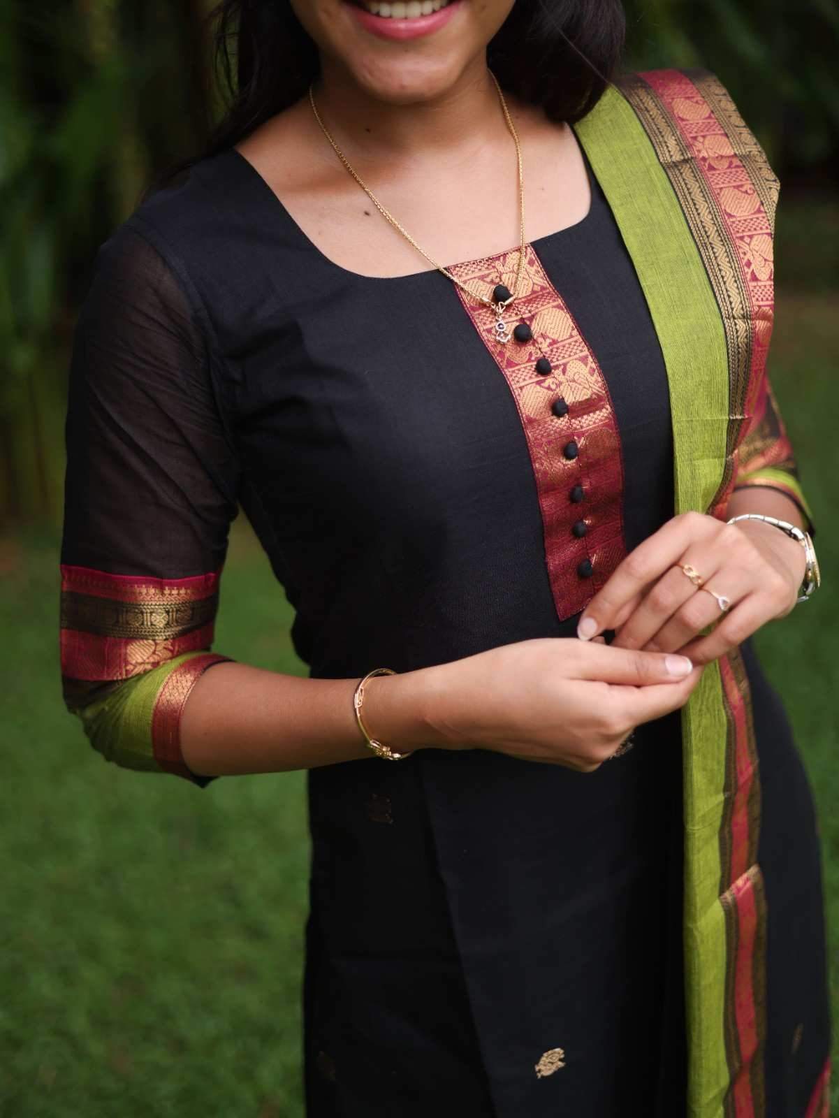 Black with Olive green rich pallu
