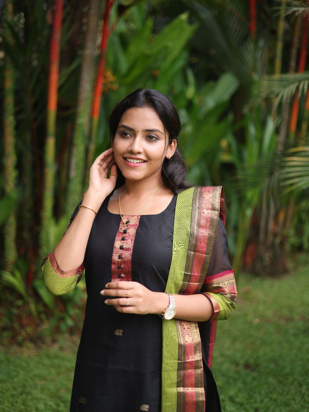 Black with Olive green rich pallu