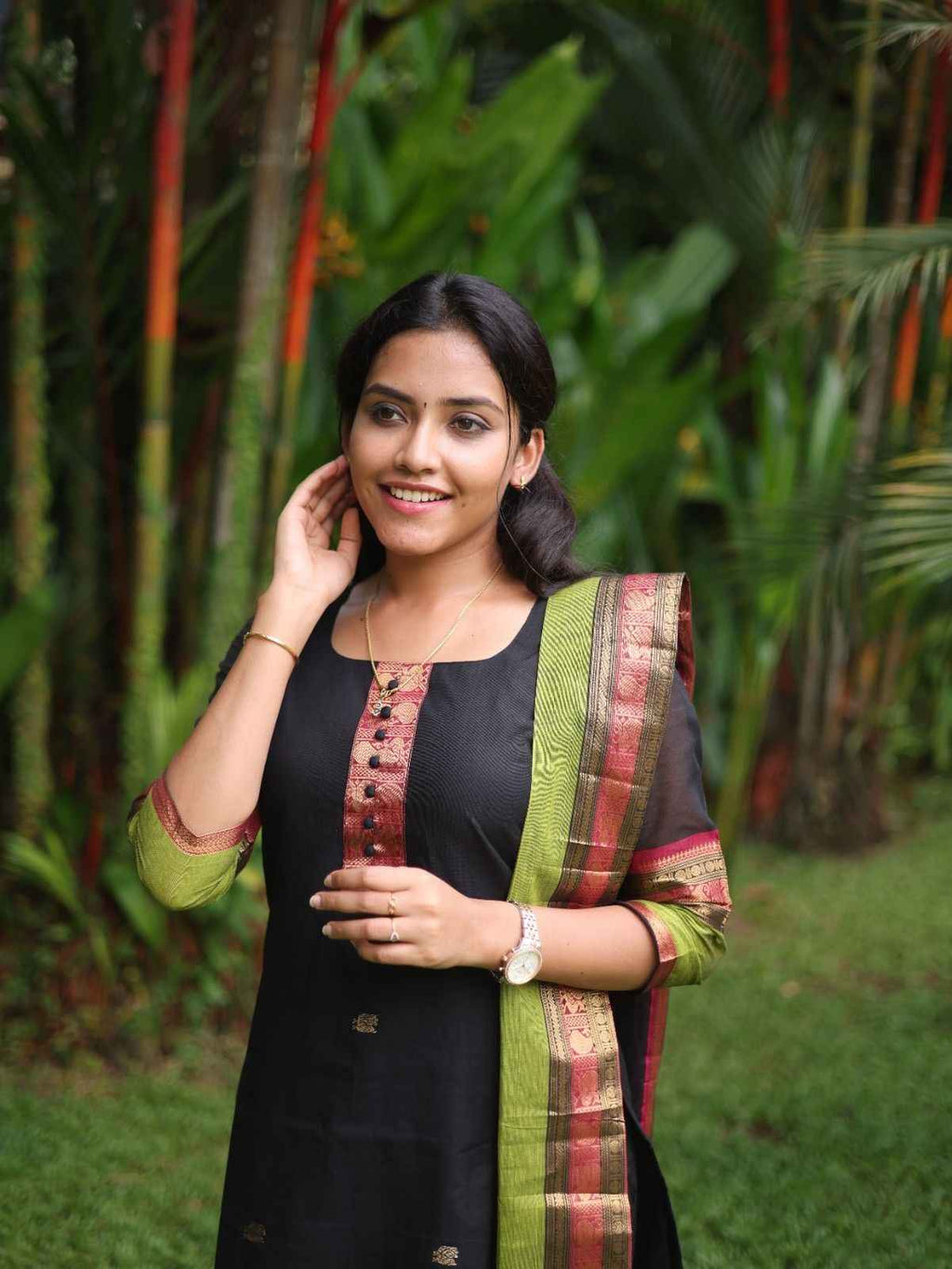 Black with Olive green rich pallu