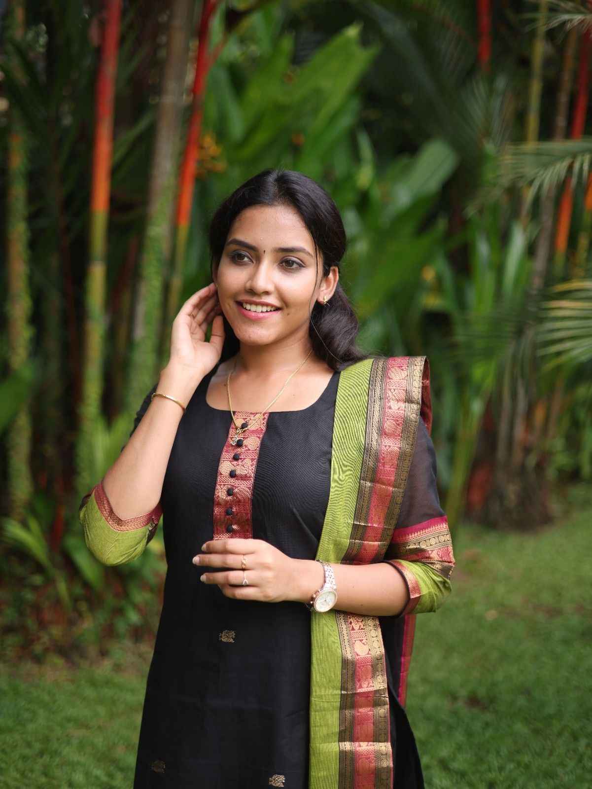 Black with Olive green rich pallu