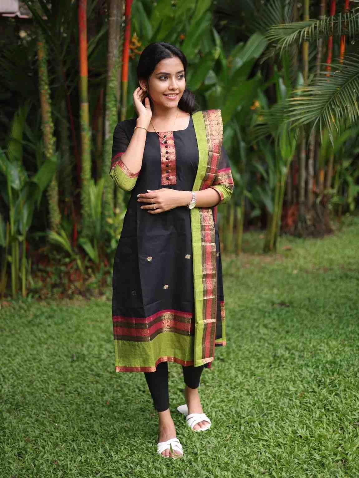 Black with Olive green rich pallu