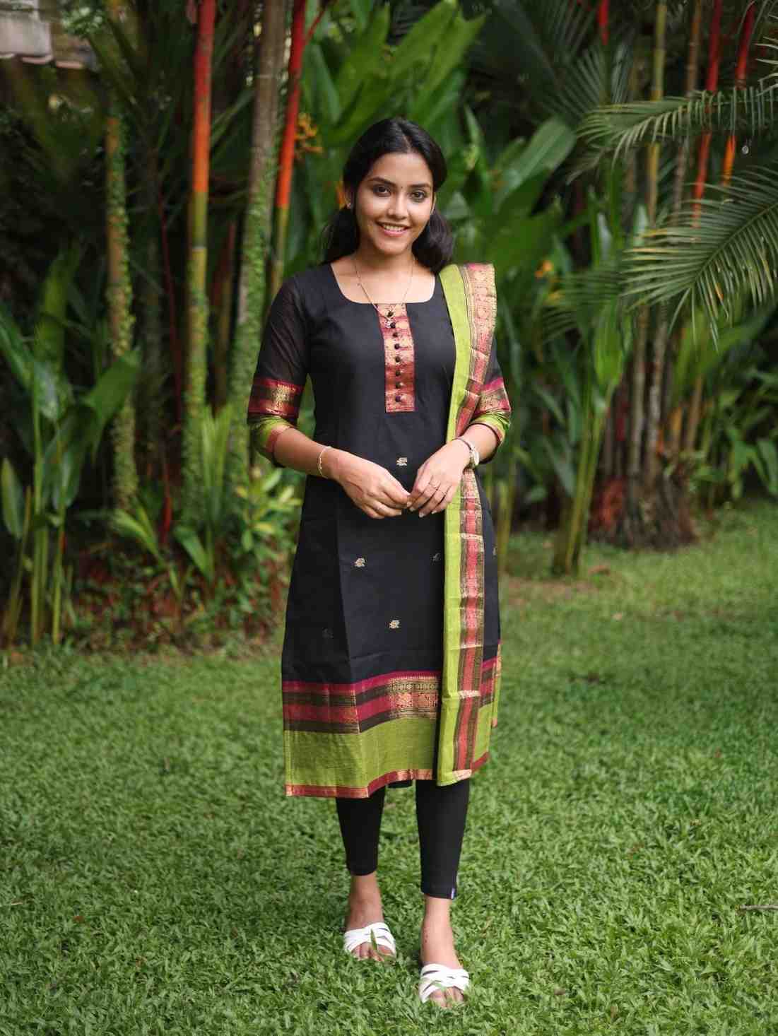 Black with Olive green rich pallu