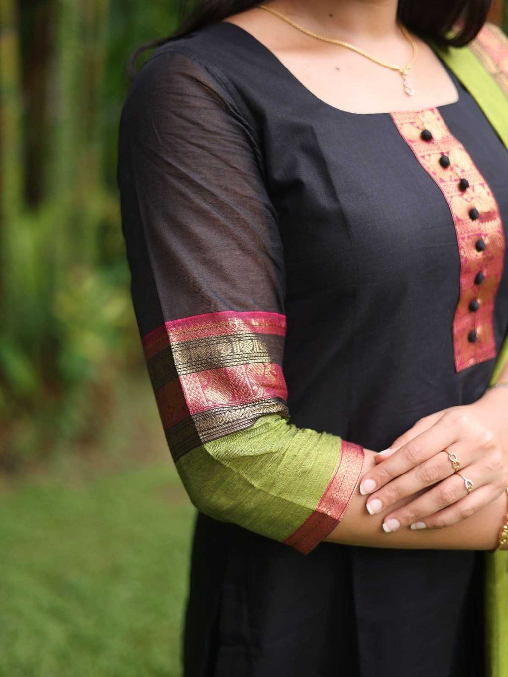 Black with Olive green rich pallu